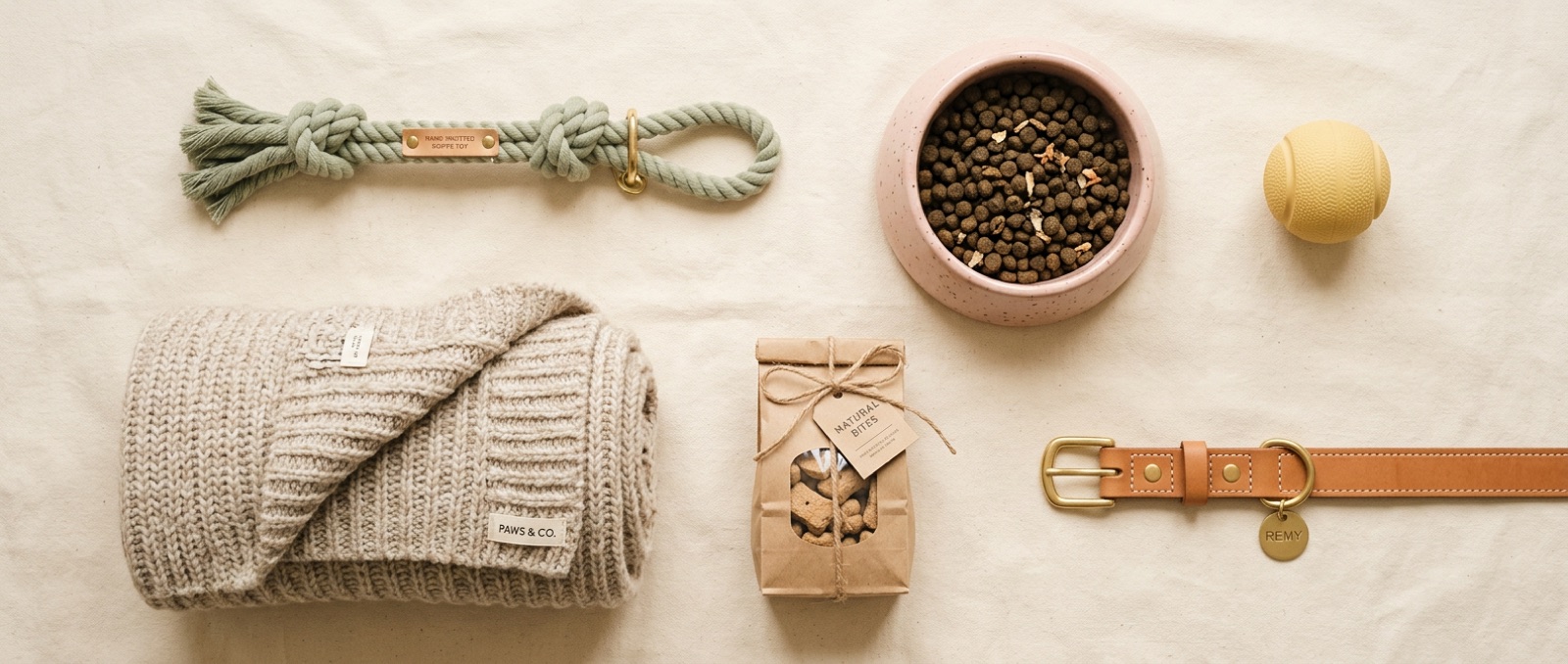 Premium pet supplies — toys, bowls, treats and a leather collar